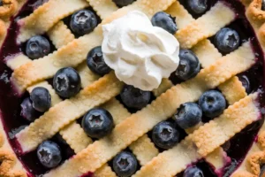 Freshly baked blueberry pie with a golden crust, made using canned blueberry pie filling